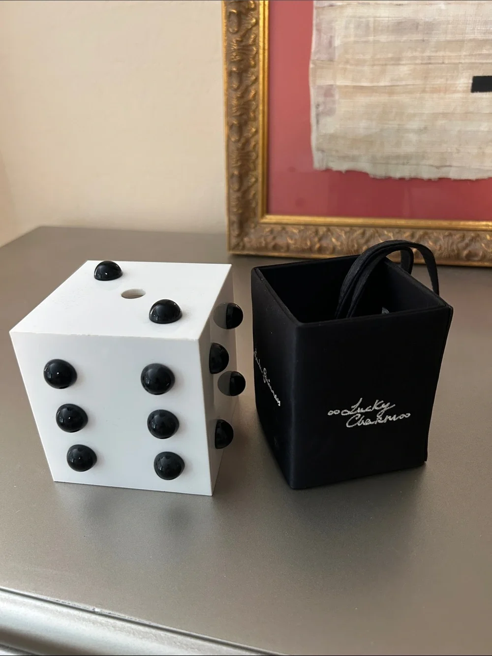Lulu Guinness wristlet that looks like a dice cube.